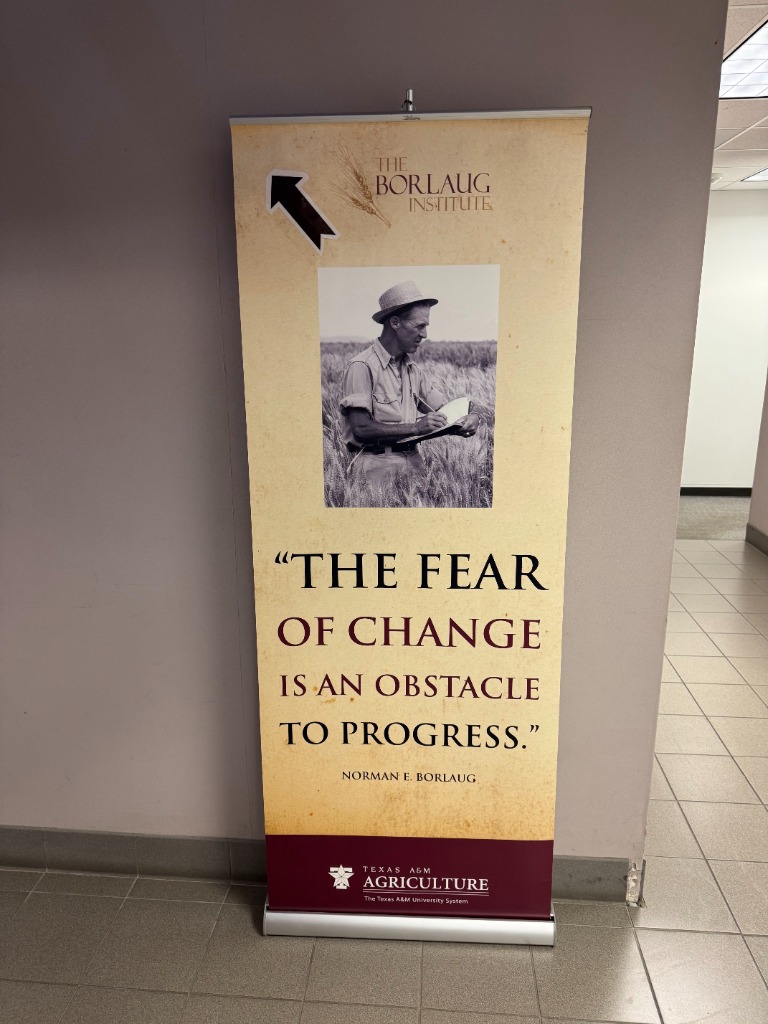 Dr. Norman Borlaug banner: The fear of change is an obstacle to progress