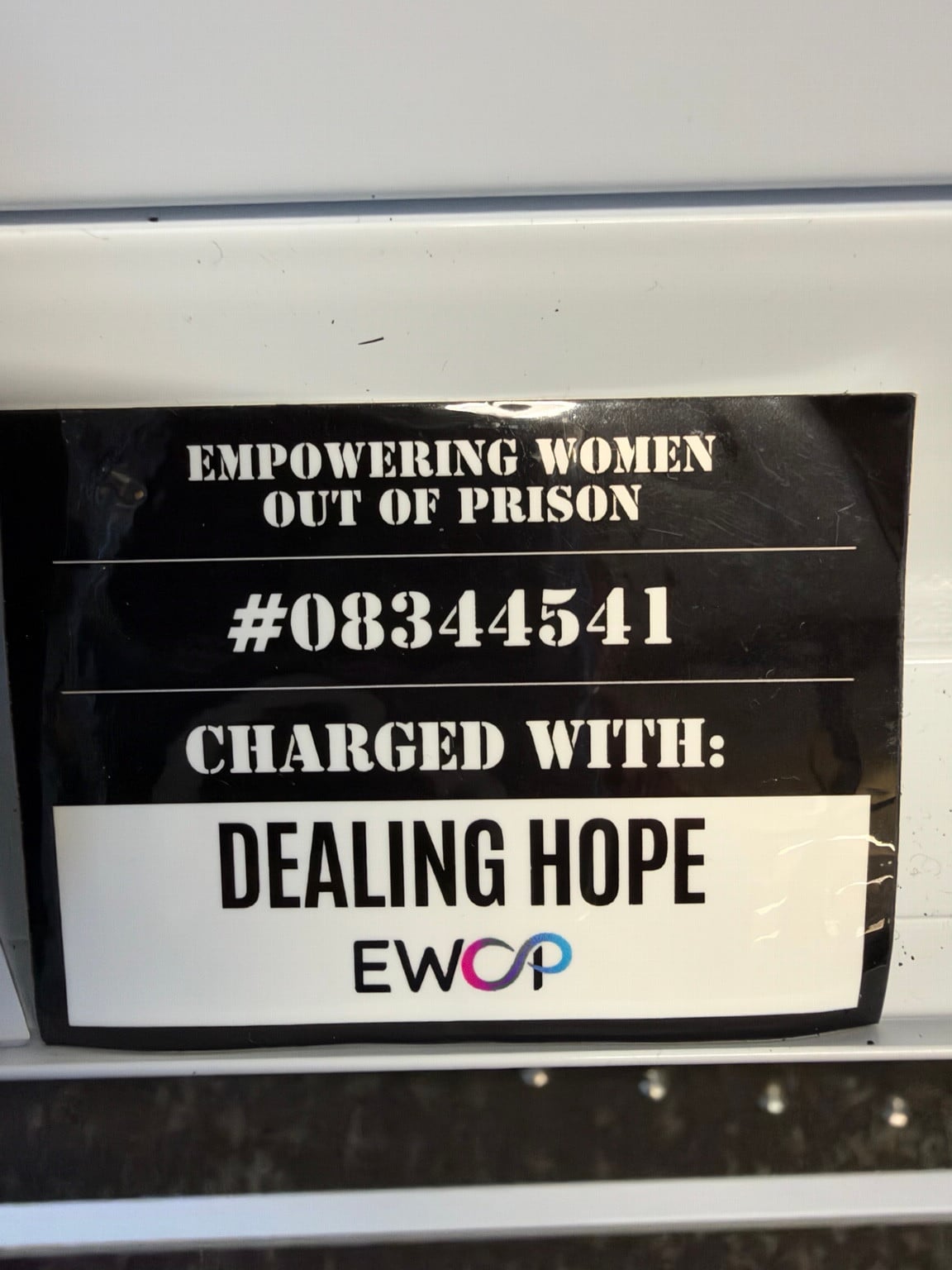 An EWOP sign with the words Dealing Hope.